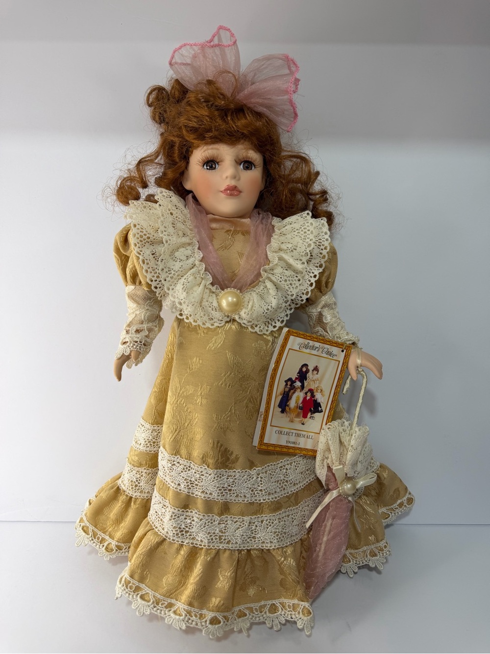 Porcelain Fashion Doll in Gold Dress with Pink Bow